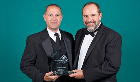 Celebrity Cruises’ Keith Lane (left), Vice President of Field Sales, accepts the Cruise Line with the Highest Client Satisfaction WAVE Award from Ken Shapiro (right), Editor-in-Chief of TravelAge West